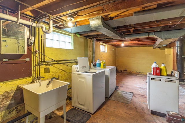 washroom featuring sink and washer and dryer