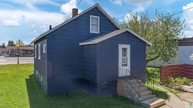 view of home's exterior featuring a lawn