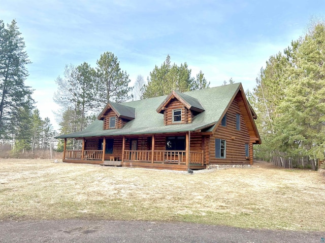 log-style house with covered porch