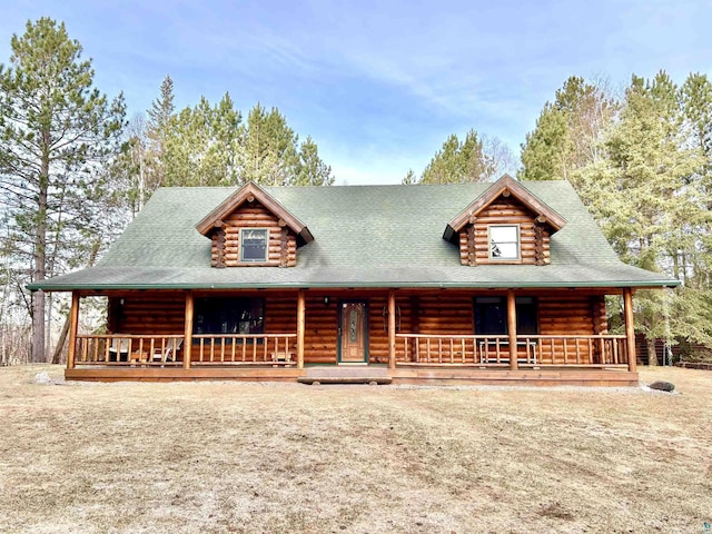 log-style house with a porch