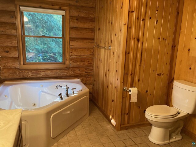 bathroom featuring log walls, a bath, and toilet