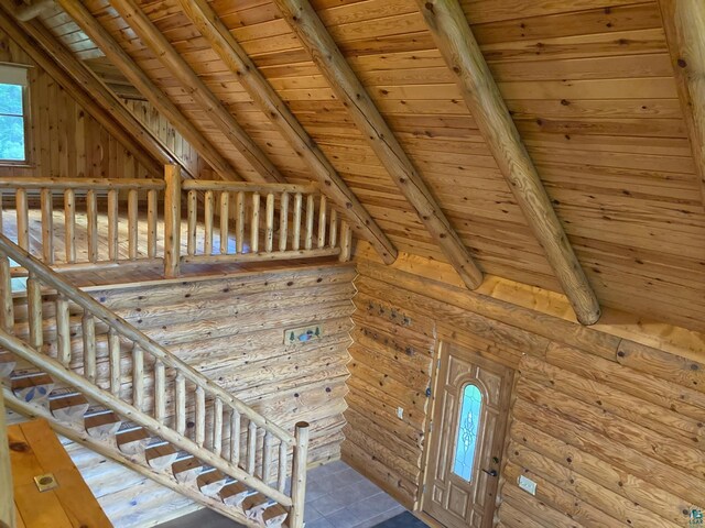 staircase with lofted ceiling with beams and wooden ceiling