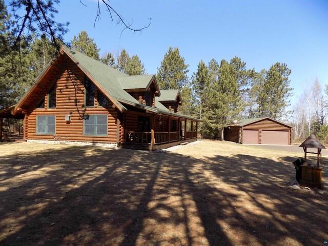 view of side of home with a garage and an outdoor structure