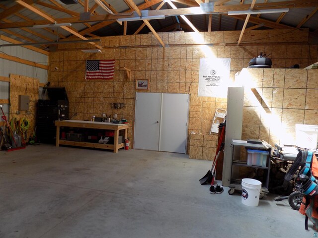 garage featuring a workshop area and electric panel