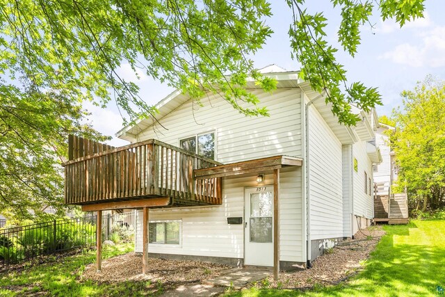 back of house featuring a deck