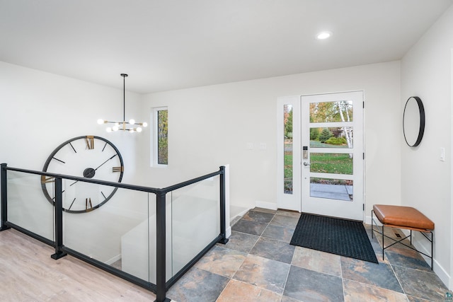 foyer entrance with an inviting chandelier