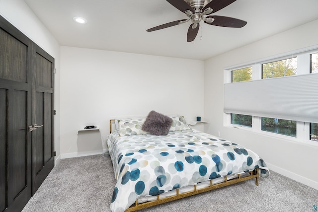 carpeted bedroom with ceiling fan