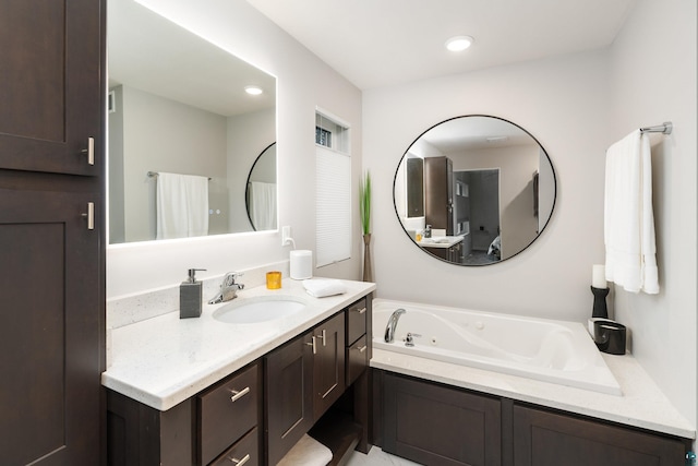 bathroom with a bathtub and vanity