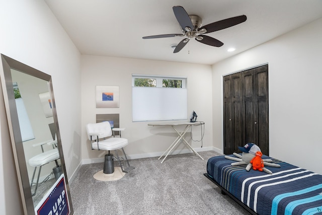 bedroom featuring carpet, ceiling fan, and a closet