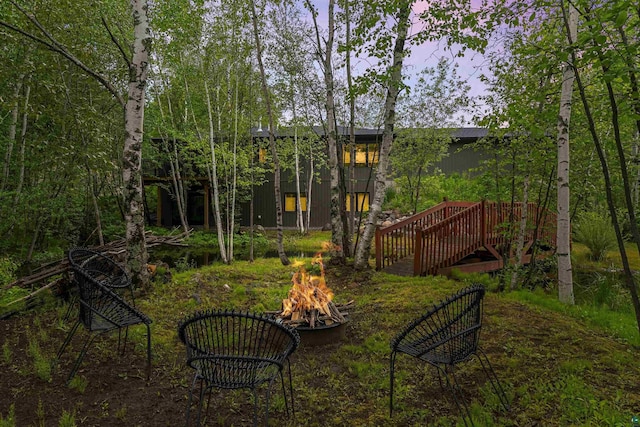 view of yard with a fire pit