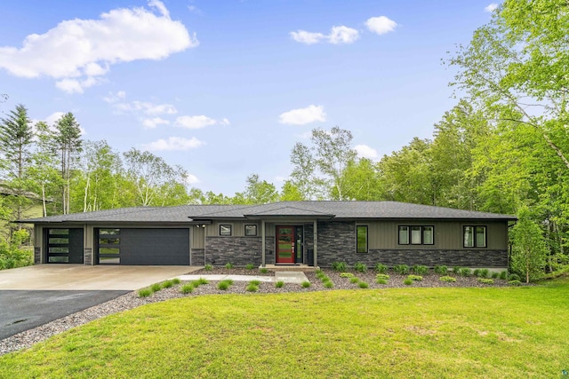 prairie-style house with a garage and a front lawn