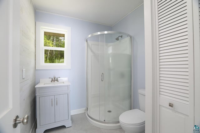 bathroom with walk in shower, vanity, toilet, and tile floors