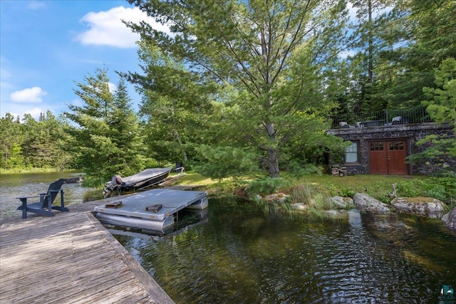 dock area featuring a water view