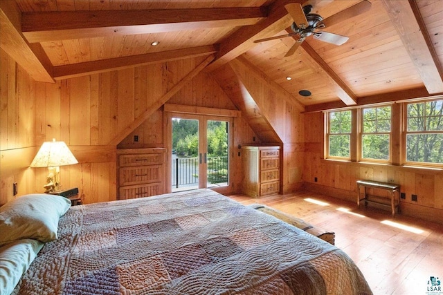 bedroom featuring access to outside, light wood-type flooring, wood ceiling, and wooden walls