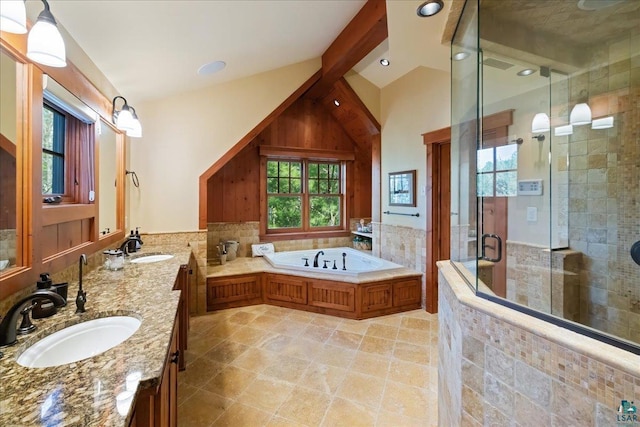 bathroom with vanity, separate shower and tub, and vaulted ceiling with beams