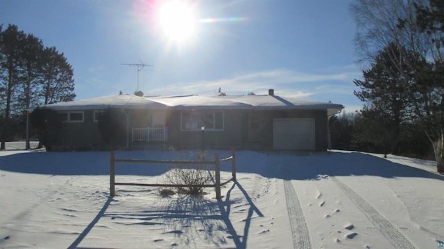 ranch-style home featuring a garage