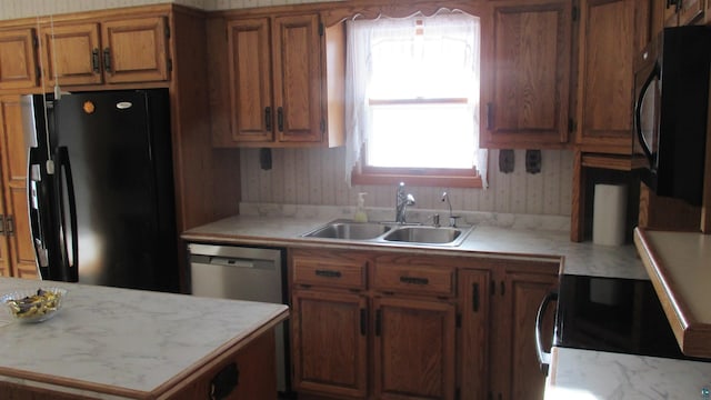 kitchen with sink and black appliances