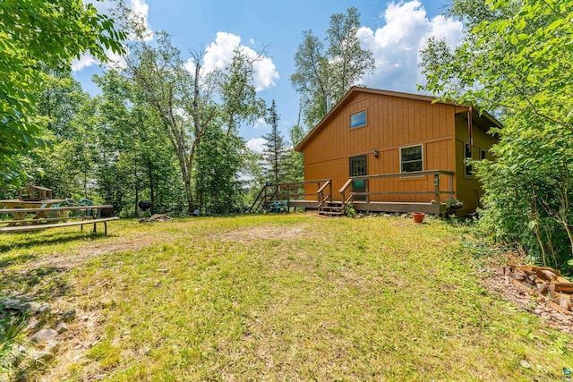 view of yard featuring a wooden deck