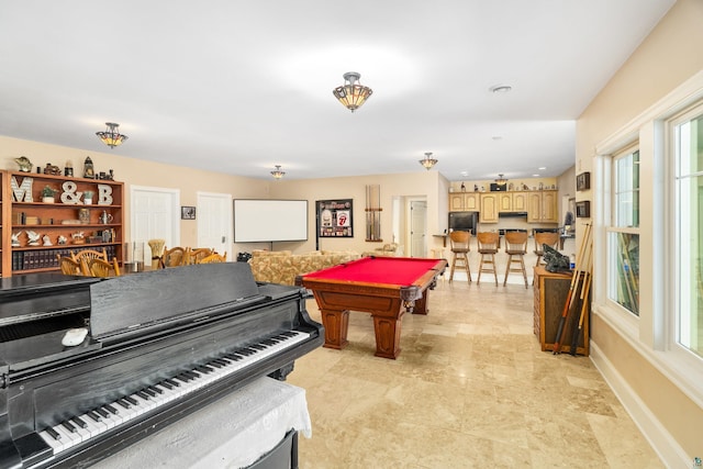 game room with pool table and baseboards