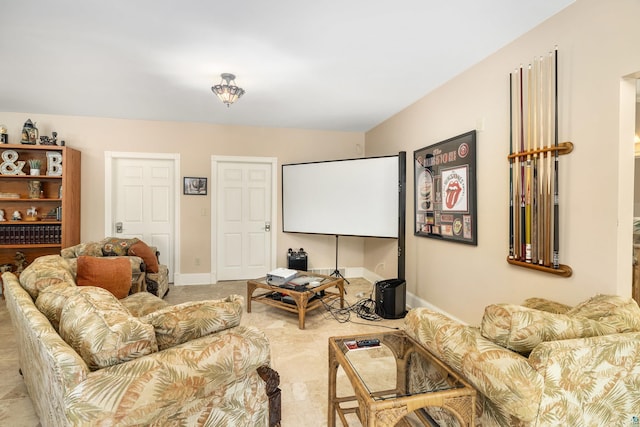 living area featuring baseboards