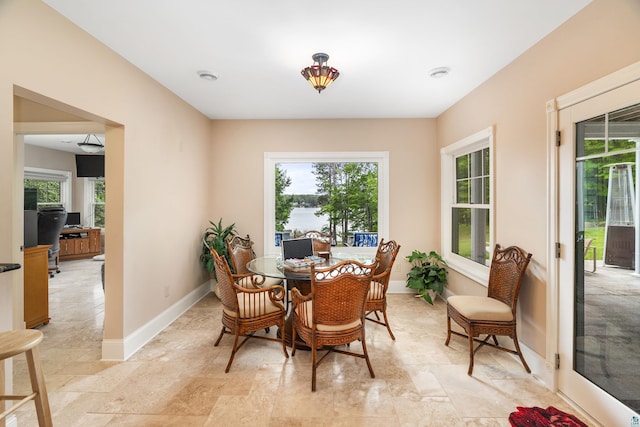 dining room featuring baseboards