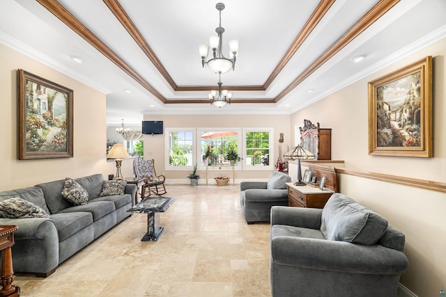 living area featuring baseboards, ornamental molding, a raised ceiling, and an inviting chandelier