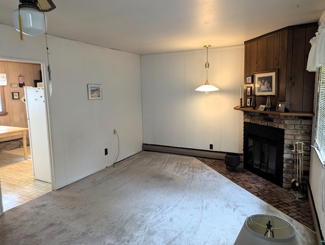 living room featuring a brick fireplace and baseboard heating