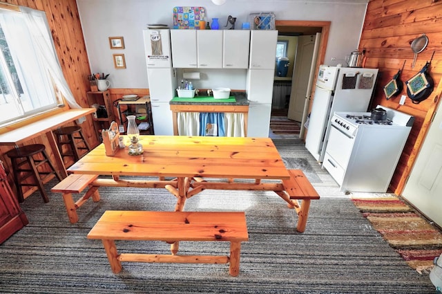 dining area with wood walls