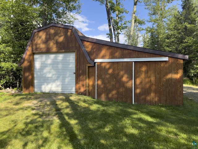 view of outdoor structure featuring a lawn