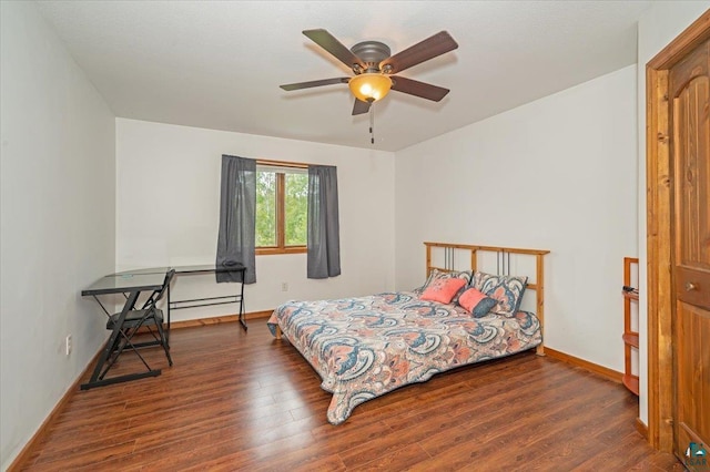 bedroom with wood-type flooring and ceiling fan