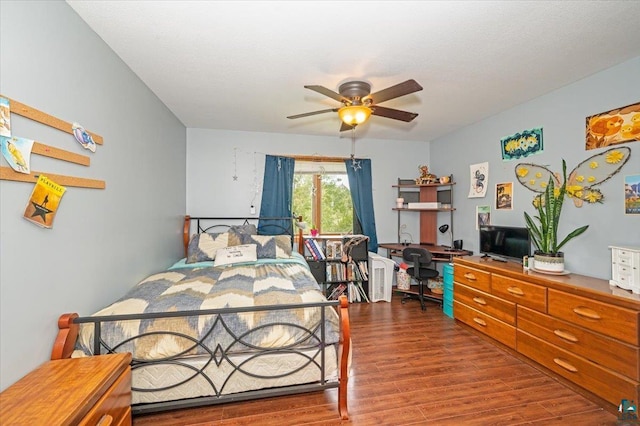 bedroom featuring hardwood / wood-style flooring and ceiling fan