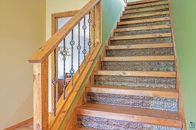 stairs with wood-type flooring