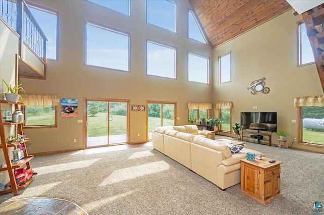 carpeted living room featuring high vaulted ceiling and wood ceiling