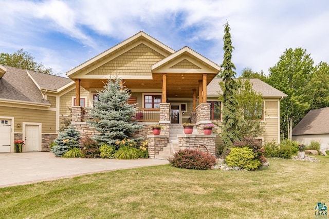 craftsman house with a porch and a front yard