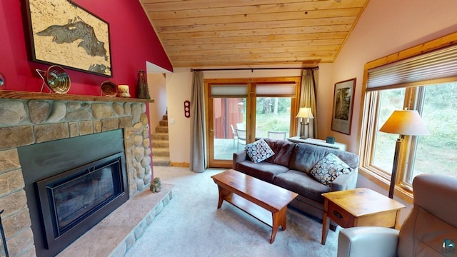 carpeted living room with lofted ceiling, wood ceiling, and a fireplace