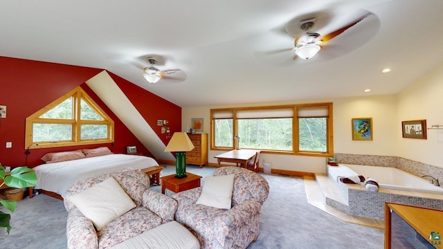 bedroom with multiple windows, vaulted ceiling, and light carpet