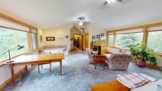 interior space with ceiling fan and vaulted ceiling