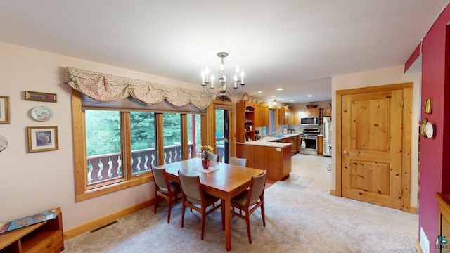 carpeted dining space with an inviting chandelier