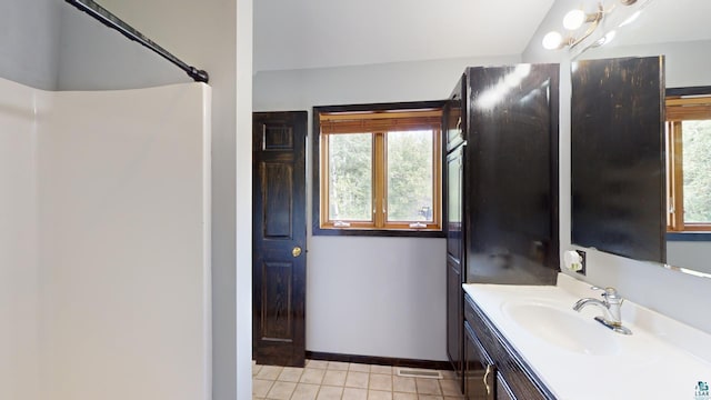 bathroom with visible vents, tile patterned floors, vanity, and baseboards