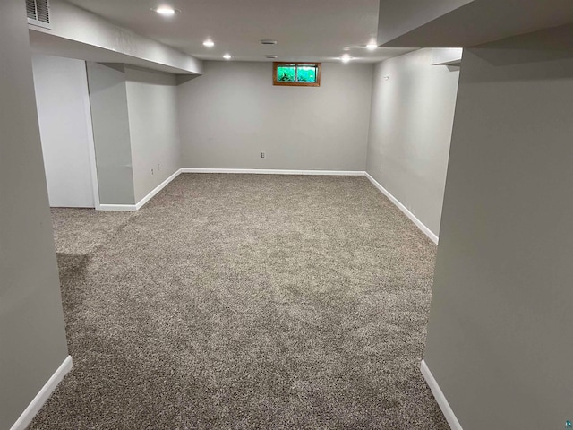 basement featuring carpet flooring