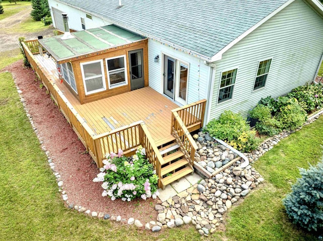 wooden deck featuring a yard