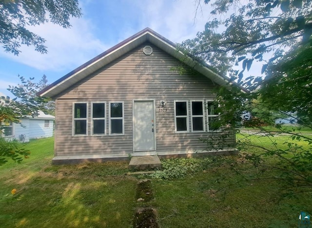 view of home's exterior featuring a lawn