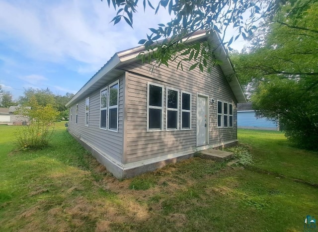 view of home's exterior featuring a yard