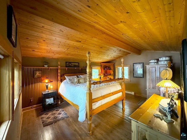 bedroom with a baseboard radiator, lofted ceiling with beams, wood finished floors, wooden ceiling, and baseboards