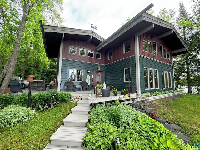 back of house with board and batten siding