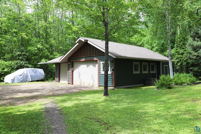 garage featuring a yard