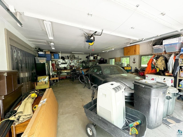 garage featuring a workshop area and a garage door opener