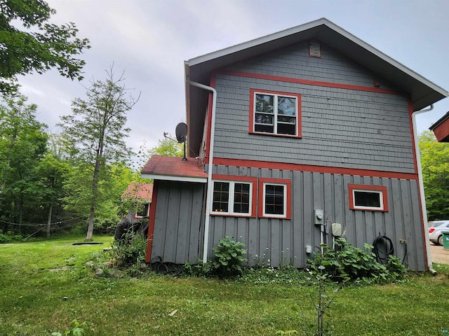 view of home's exterior featuring a yard