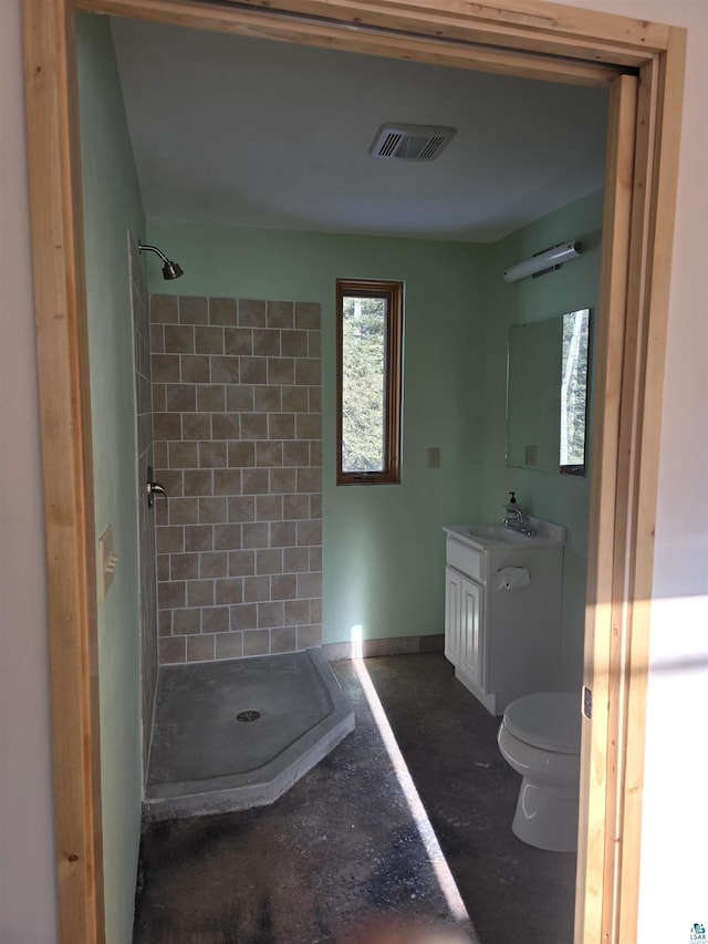 full bathroom with visible vents, toilet, a stall shower, and vanity