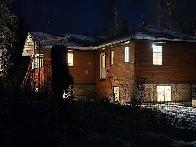 view of property exterior at twilight